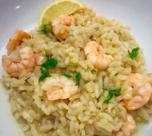 Lemon and prawn risotto garnished iwth fresh parsley