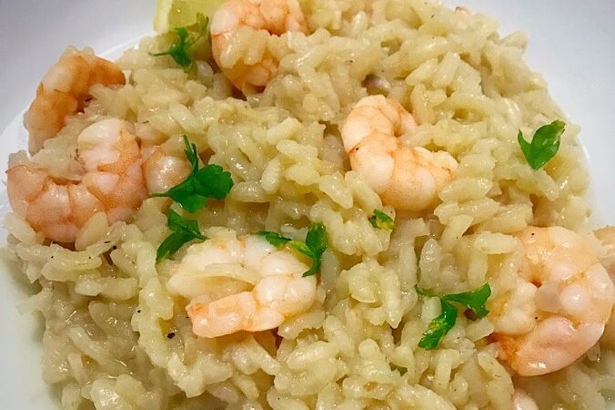 Lemon and prawn risotto garnished iwth fresh parsley