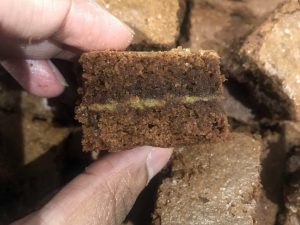 Cooked choclate broniew with salted caramel middle layer showing