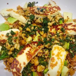 Chickpea and quinao hot salat with halloumi and honey walnut dressing