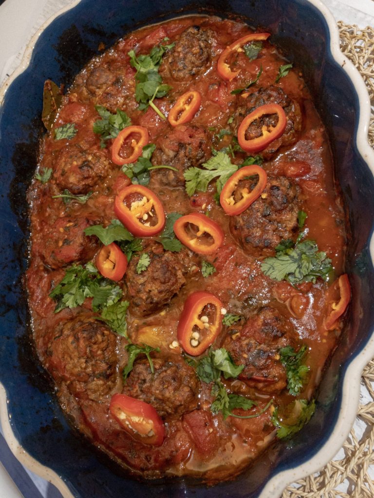 freshly baked koftas in sauce