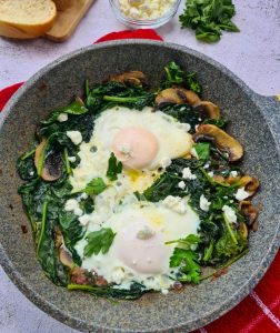 Eggs fried in leafy greens